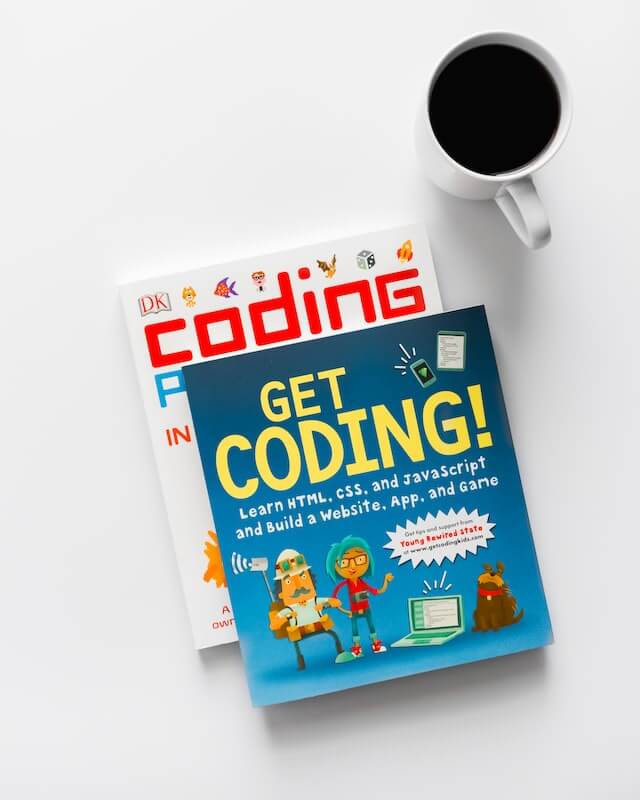 A stack of coding books.